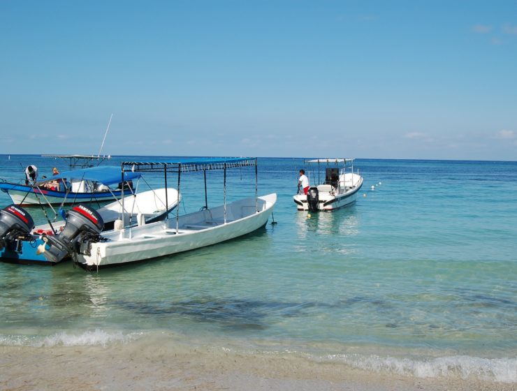 boats parked off the coast of Roatan, Honduras
