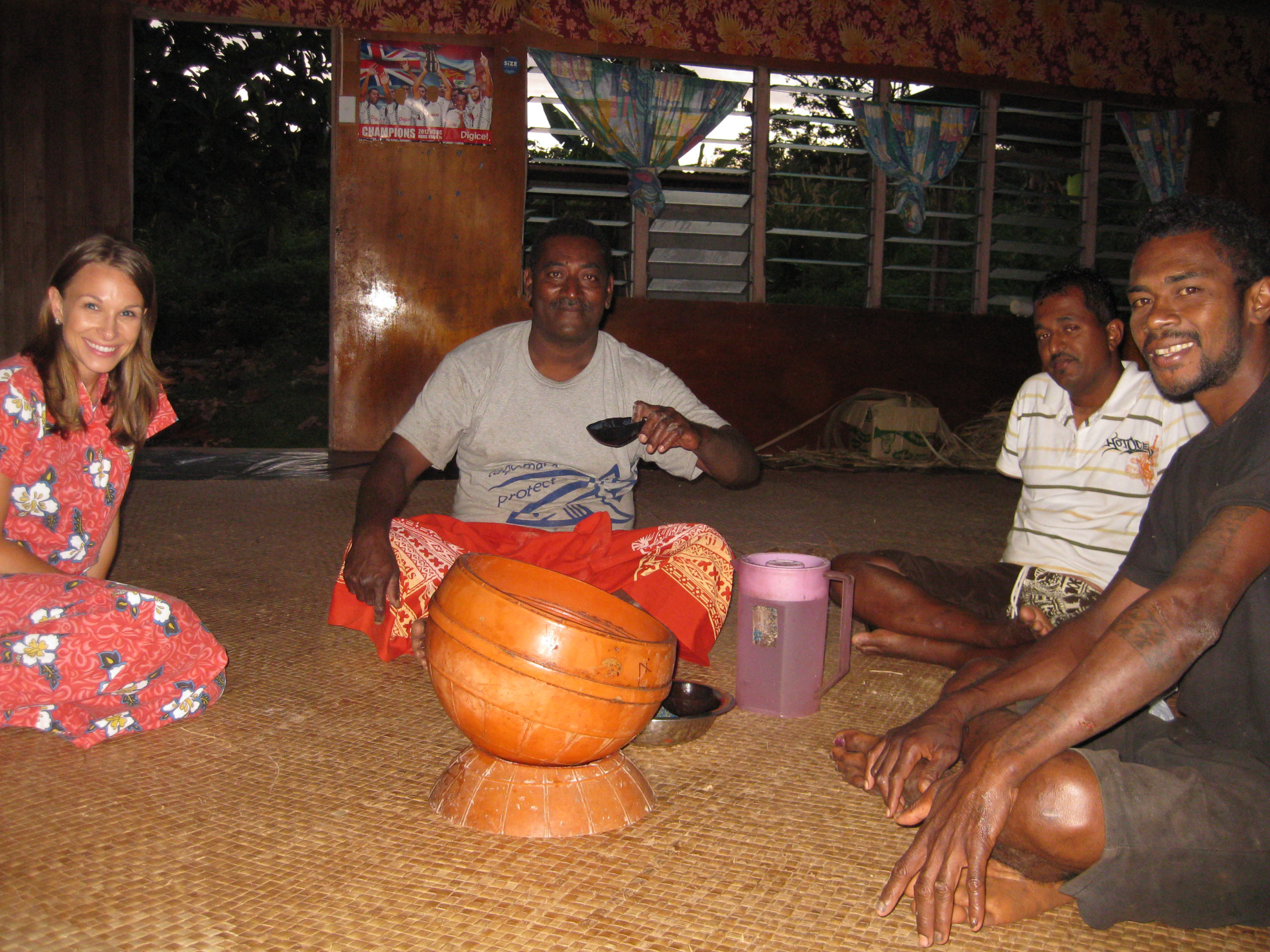 The author meeting with community members in Fiji over coffee. Photo by CORAL staff