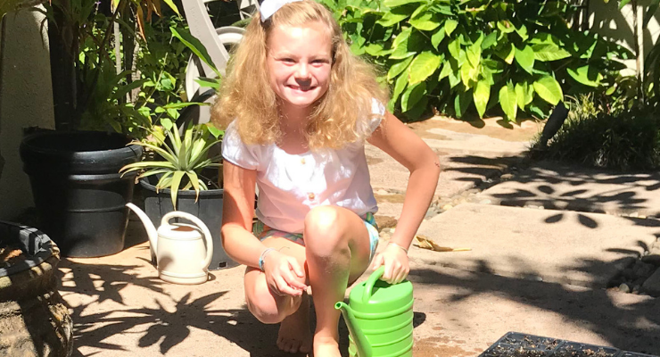 Abby Rogers poses with her plants