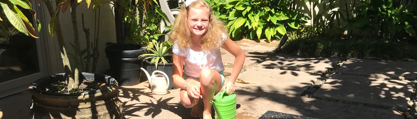 Abby Rogers poses with her plants